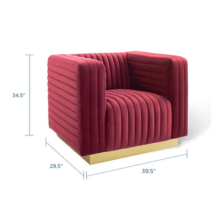 Red velvet vertical-channel tufted armchair with a gold base; modern block silhouette and plush cushions.