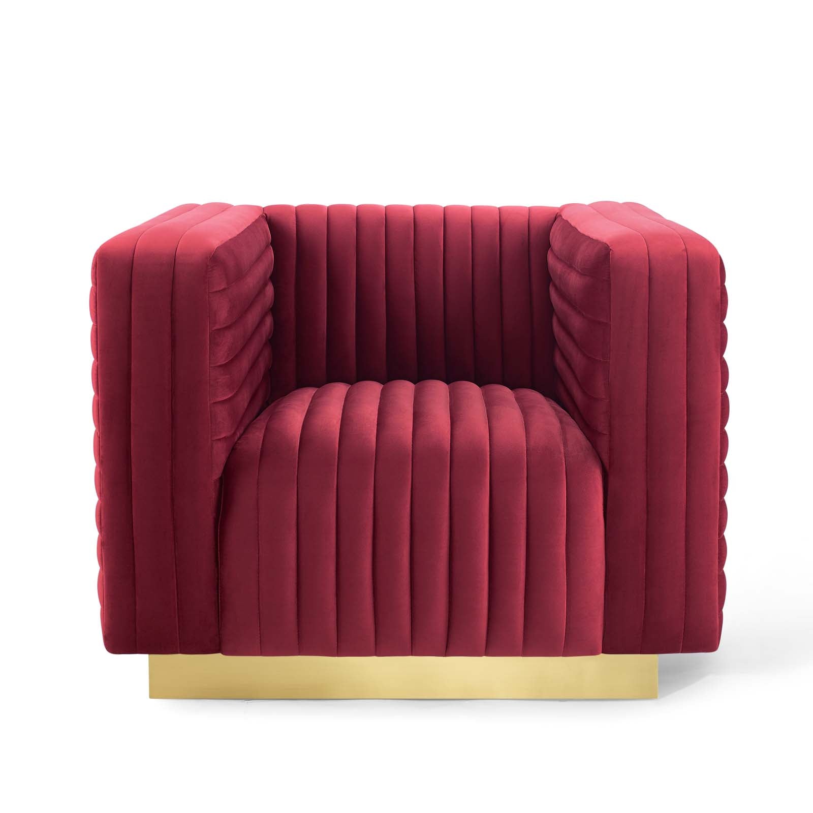 Maroon velvet channel-tufted armchair with gold base, modern luxe seating.