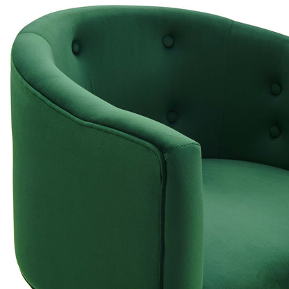 Emerald green fabric armchair with curved arms and tufted back for a plush modern lounge.