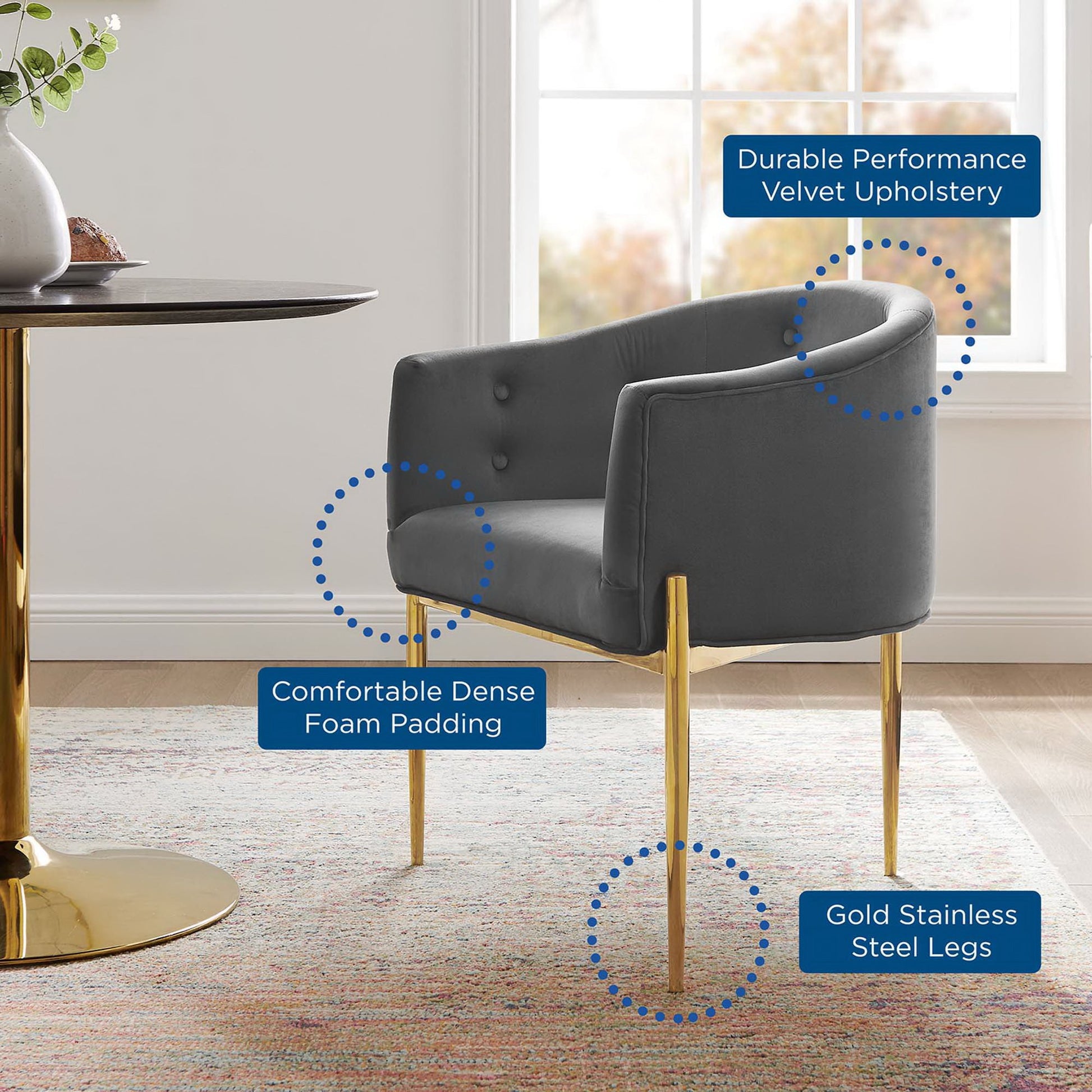 Gray tufted velvet accent chair with gold stainless steel legs, plush upholstery & dense foam padding.