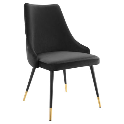 Black upholstered dining chair with curved high back, padded seat, and gold-tone tips on tapered legs.
