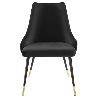 Black velvet upholstered dining side chair with a tall curved back, cushioned seat, and gold-tipped black metal legs.