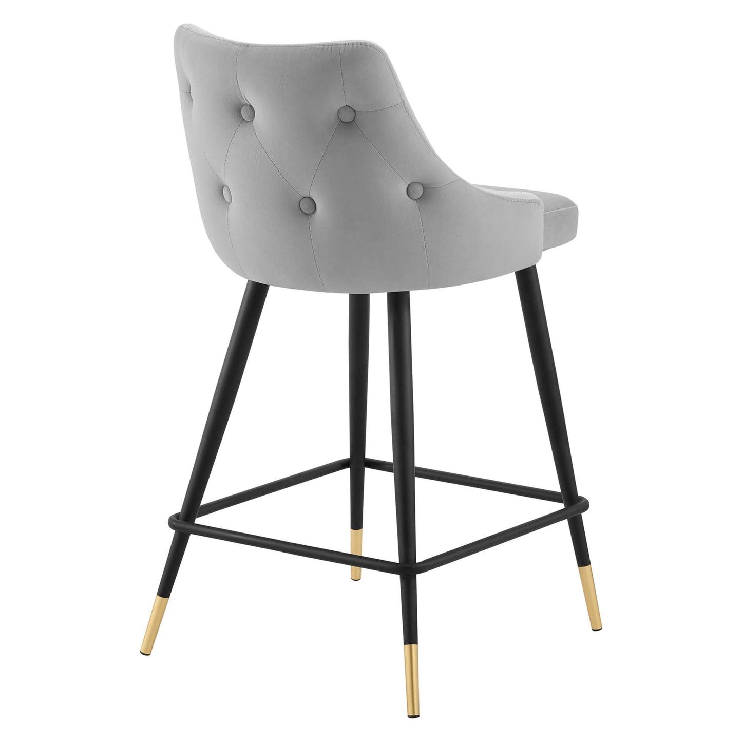 Grey tufted counter stool with curved back, black metal legs, gold-tone foot caps, and square footrest.