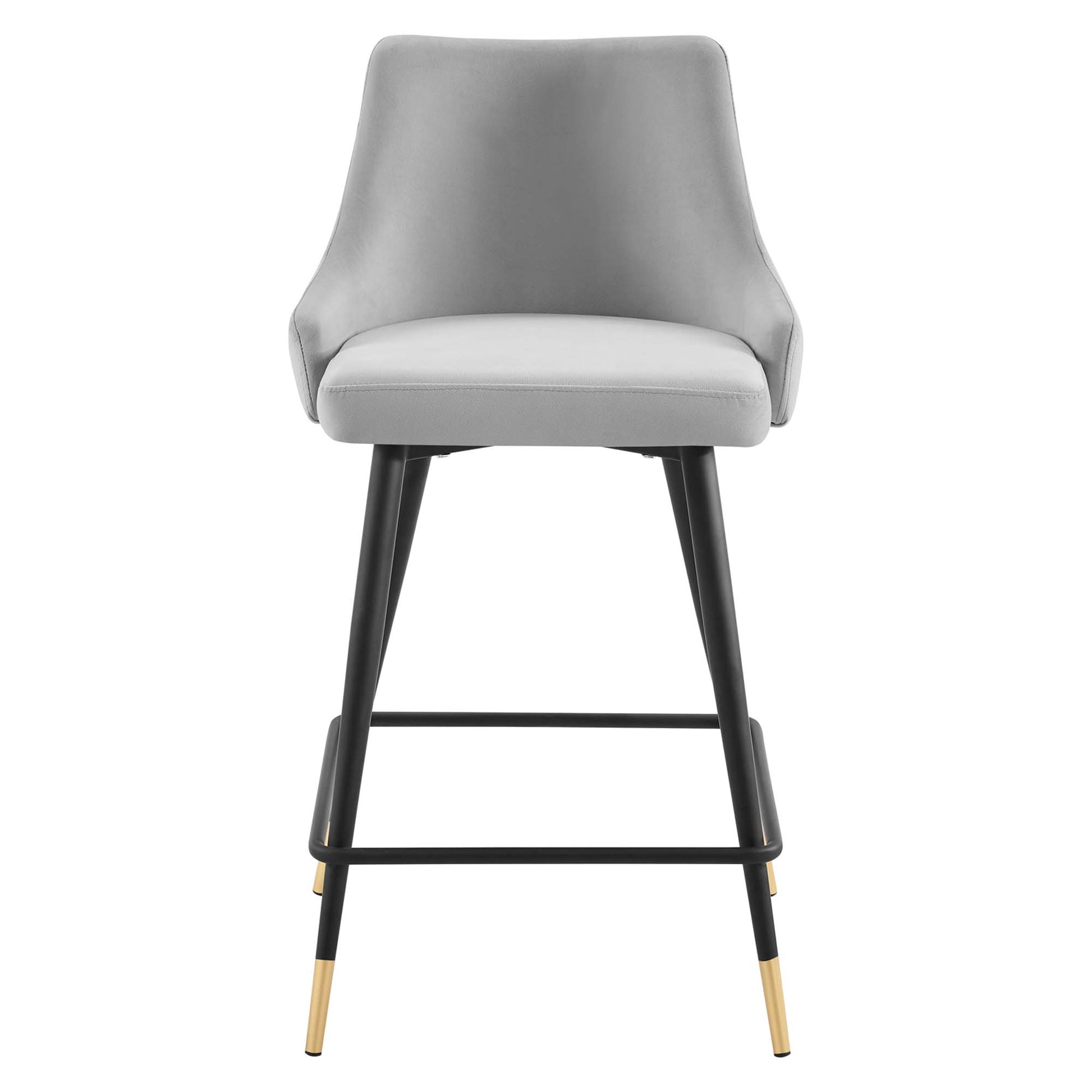 Gray upholstered counter stool with curved back, black metal legs, gold-tipped feet and a footrest.