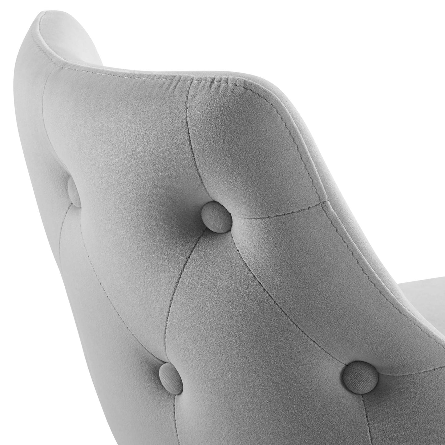 Light gray tufted upholstery on a curved back of a counter stool with fabric-covered buttons.