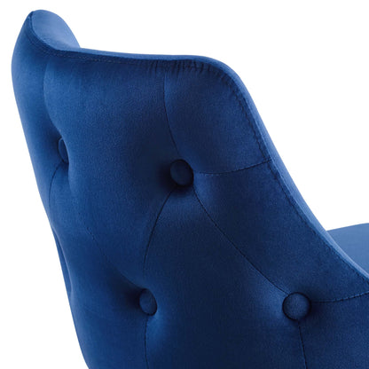 Navy blue velvet tufted counter stool with button detailing and curved silhouette.