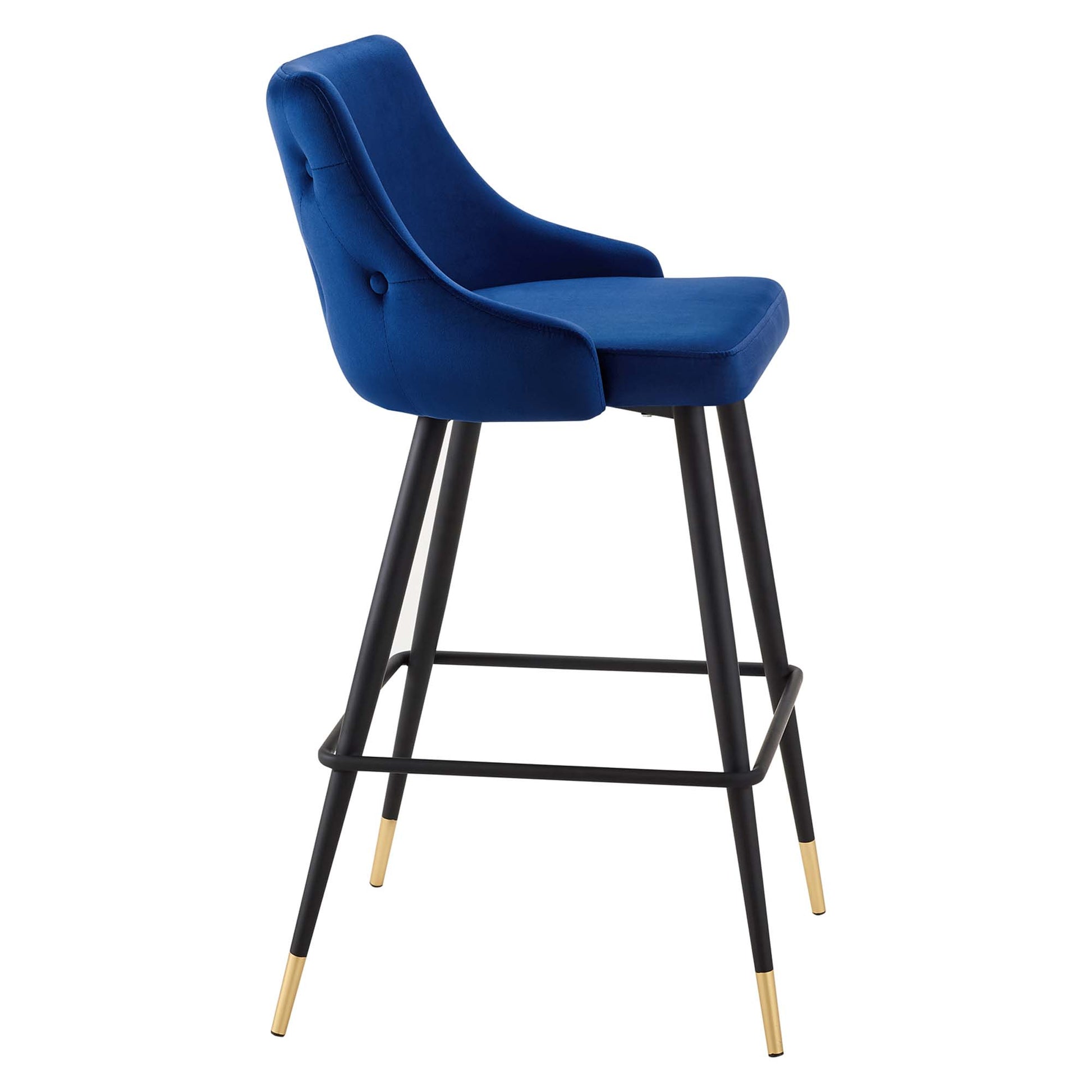 Navy blue velvet upholstered bar stool with curved back and seat, black metal legs, footrest, and gold-tipped feet.