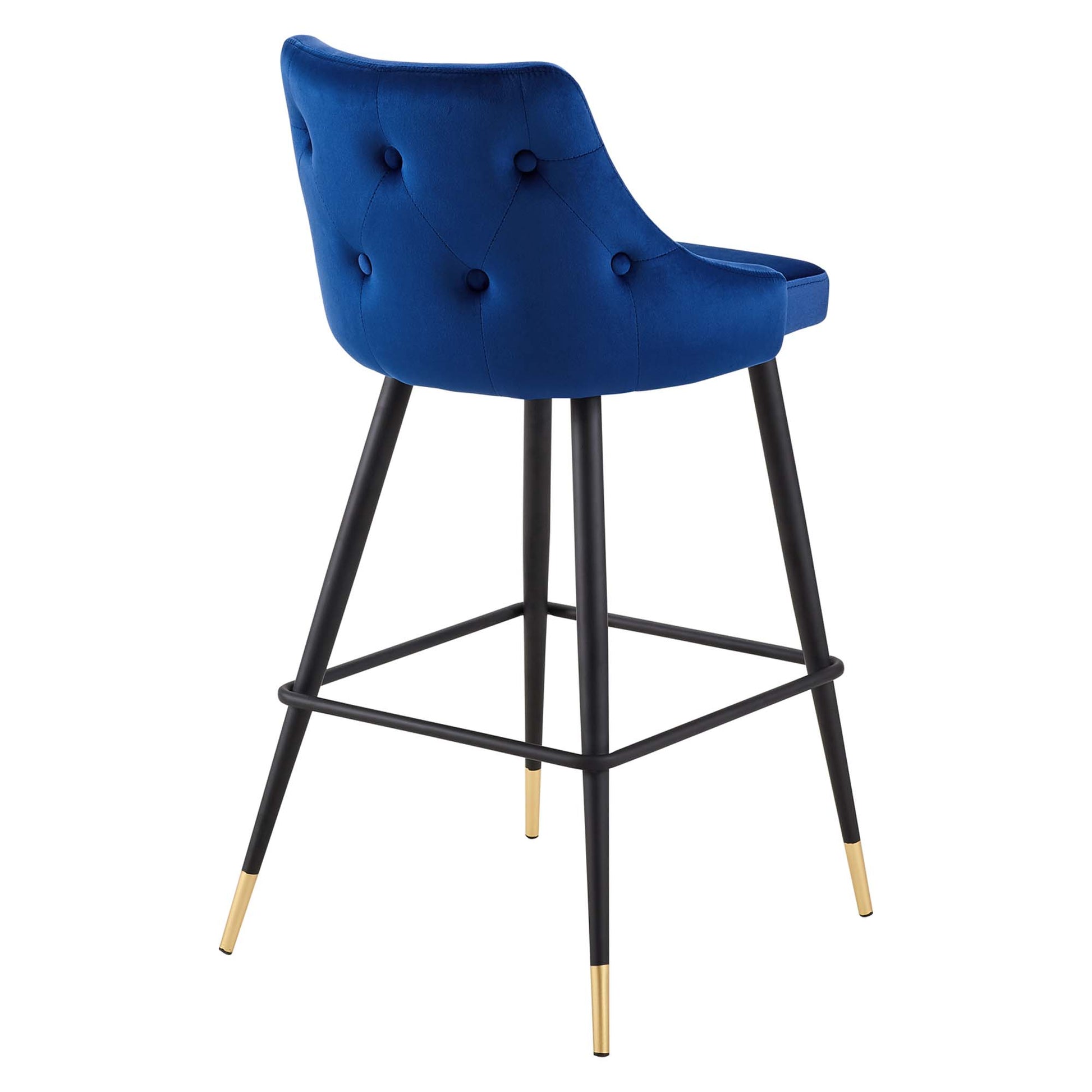 Navy velvet tufted bar stool with curved back, black metal legs, and gold-tone tips.