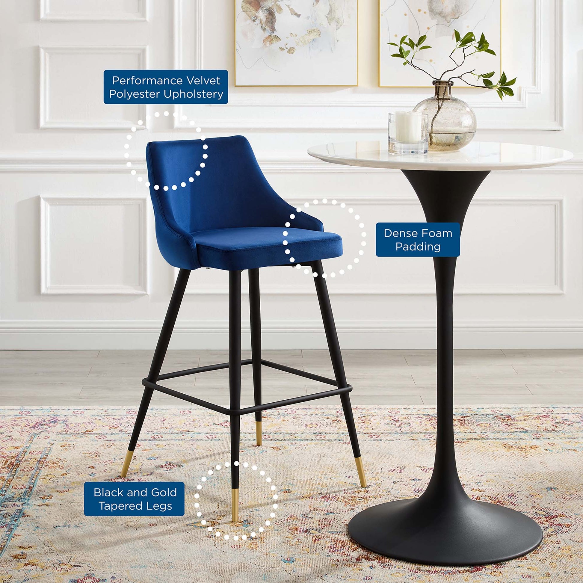 Navy velvet bar stool with performance velvet upholstery, dense foam padding, and black tapered legs with gold tips.