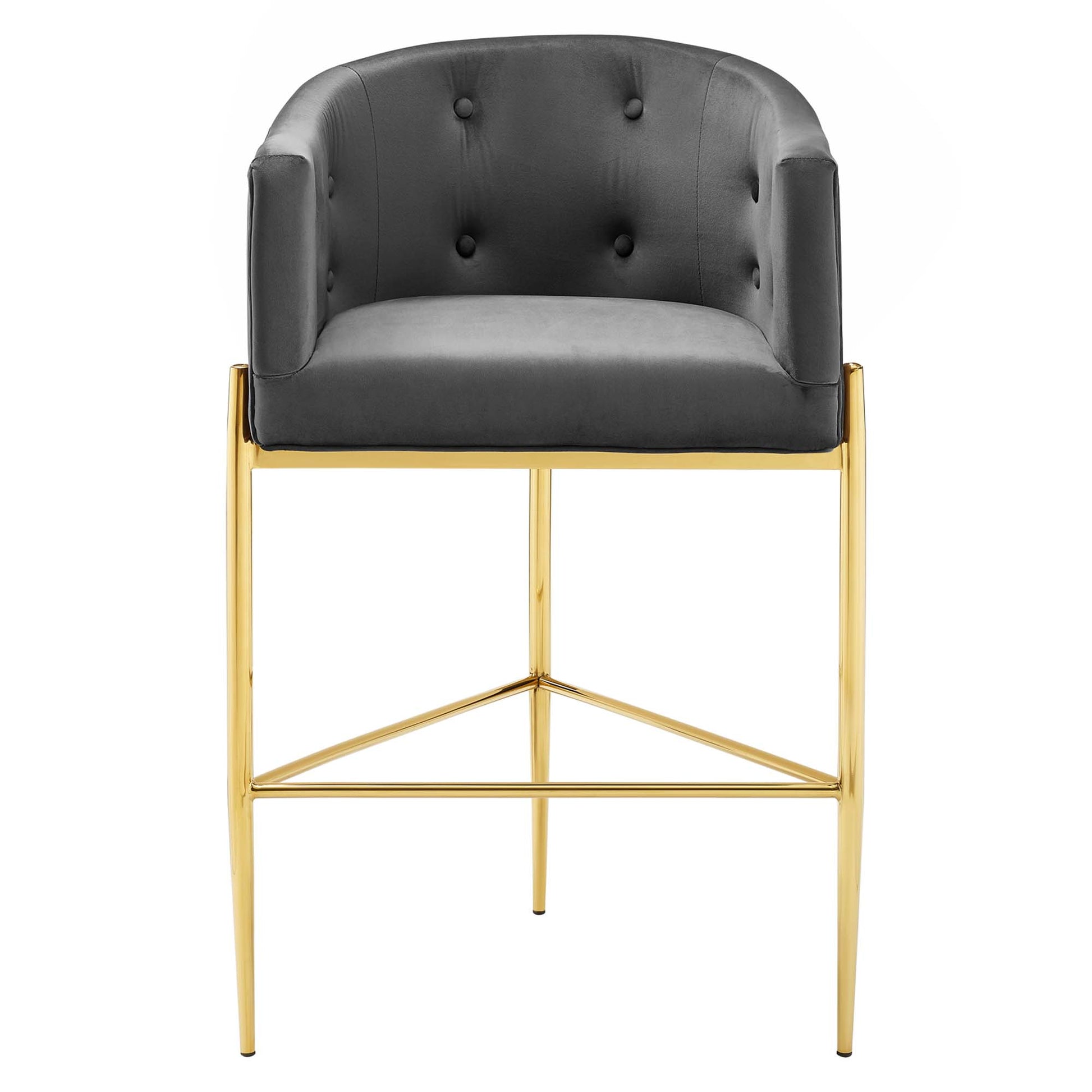 Charcoal tufted velvet bar stool with a gold metal frame, padded arms and footrest.
