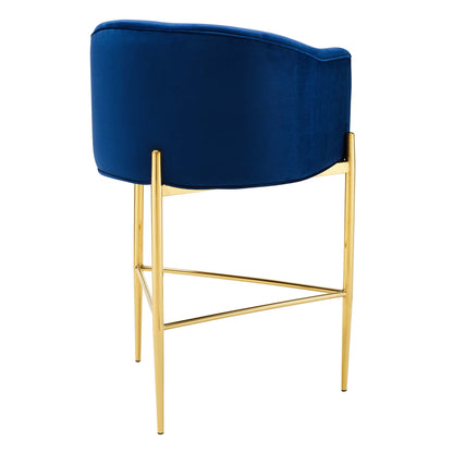 Navy blue velvet bar stool with a tufted seat, a gold-tone metal frame & slender legs.