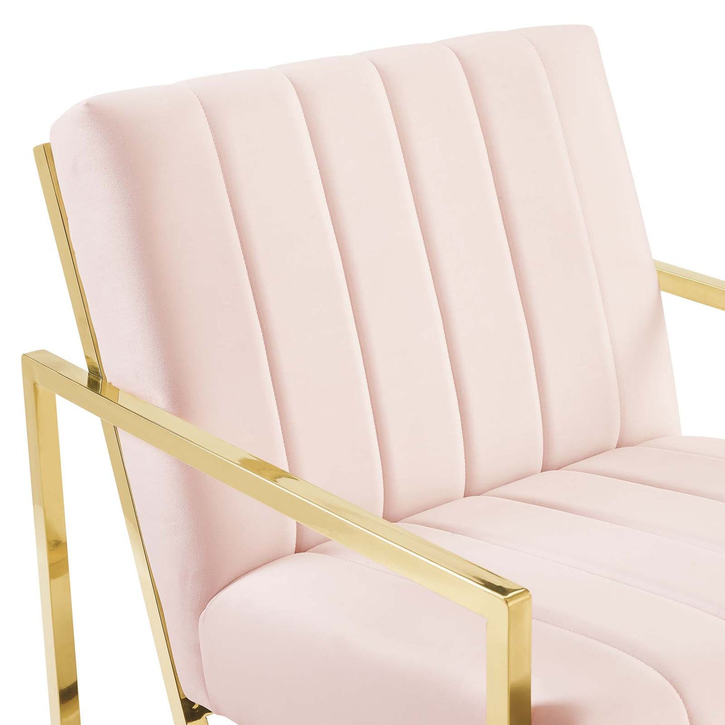 Pink velvet accent chair with a gold metal frame, channel-tufted back, square arms, glam mid-century style.