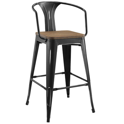 Black metal bar stool with brown wooden seat, curved back and arm supports, industrial style.