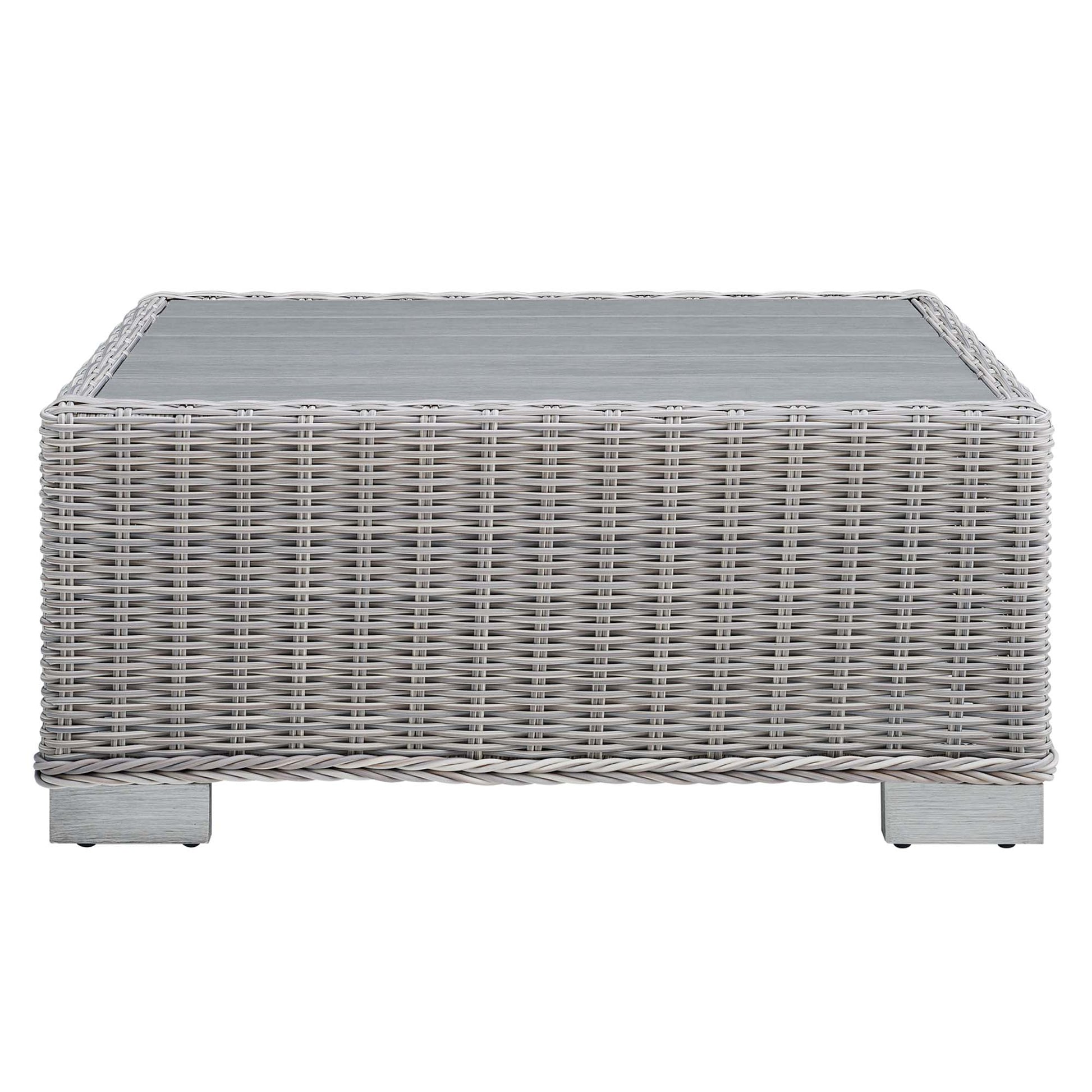Rectangular light gray wicker coffee table with glass top, woven rattan style for outdoor patio use.