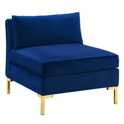 Navy velvet armless chair with plush back and seat cushions and gold metal legs, modern chic.