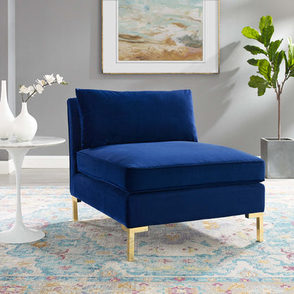 Navy blue performance velvet armless chair with square cushions & gold metal legs, modern glam living room accent.