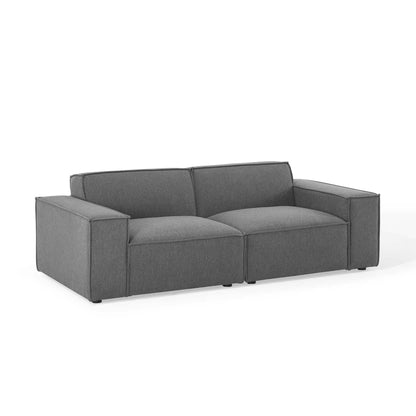 Brown fabric 2-piece sectional sofa with boxy arms and two seat cushions in a contemporary living room style.