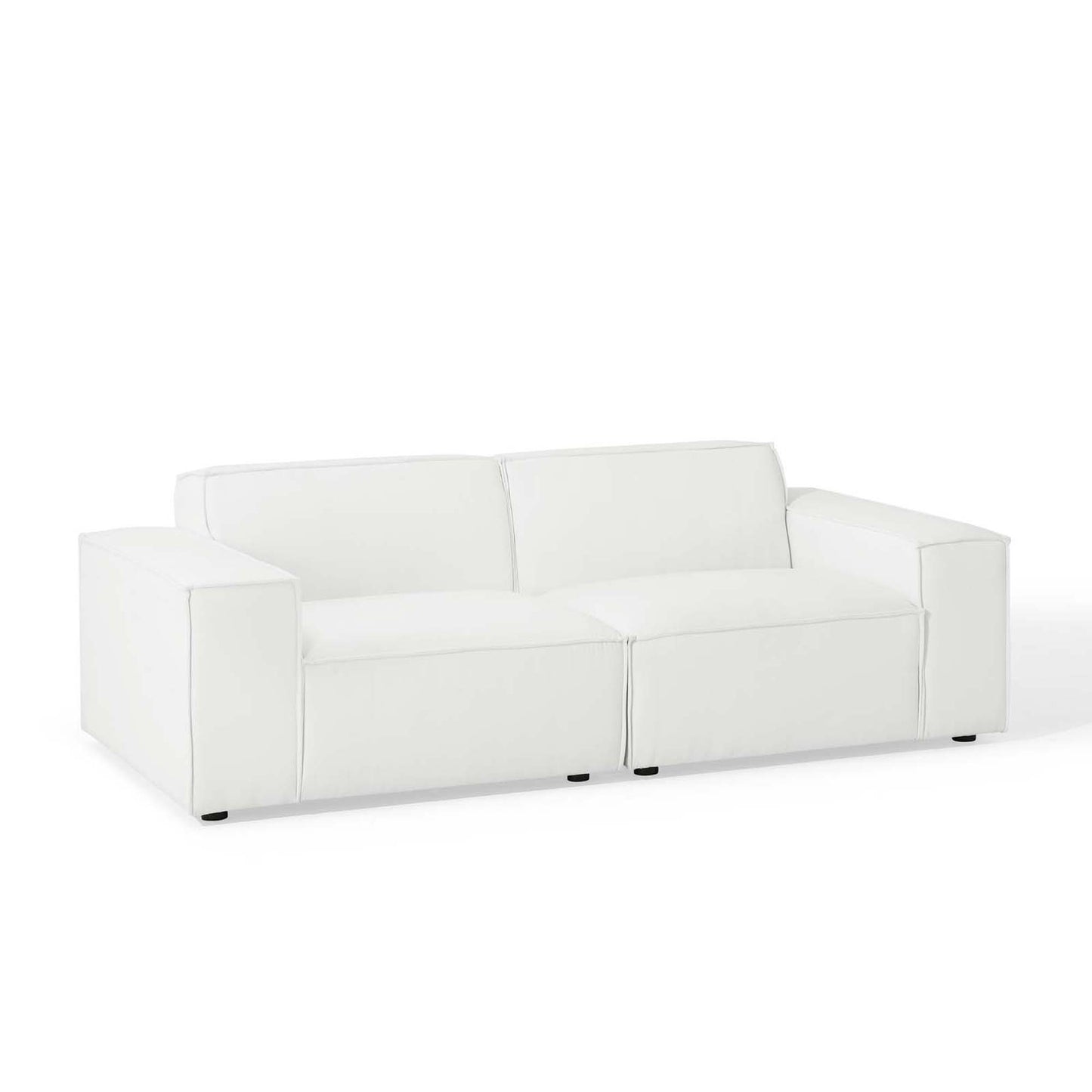 White faux leather sofa with square arms, two-seat cushions, and short black legs.