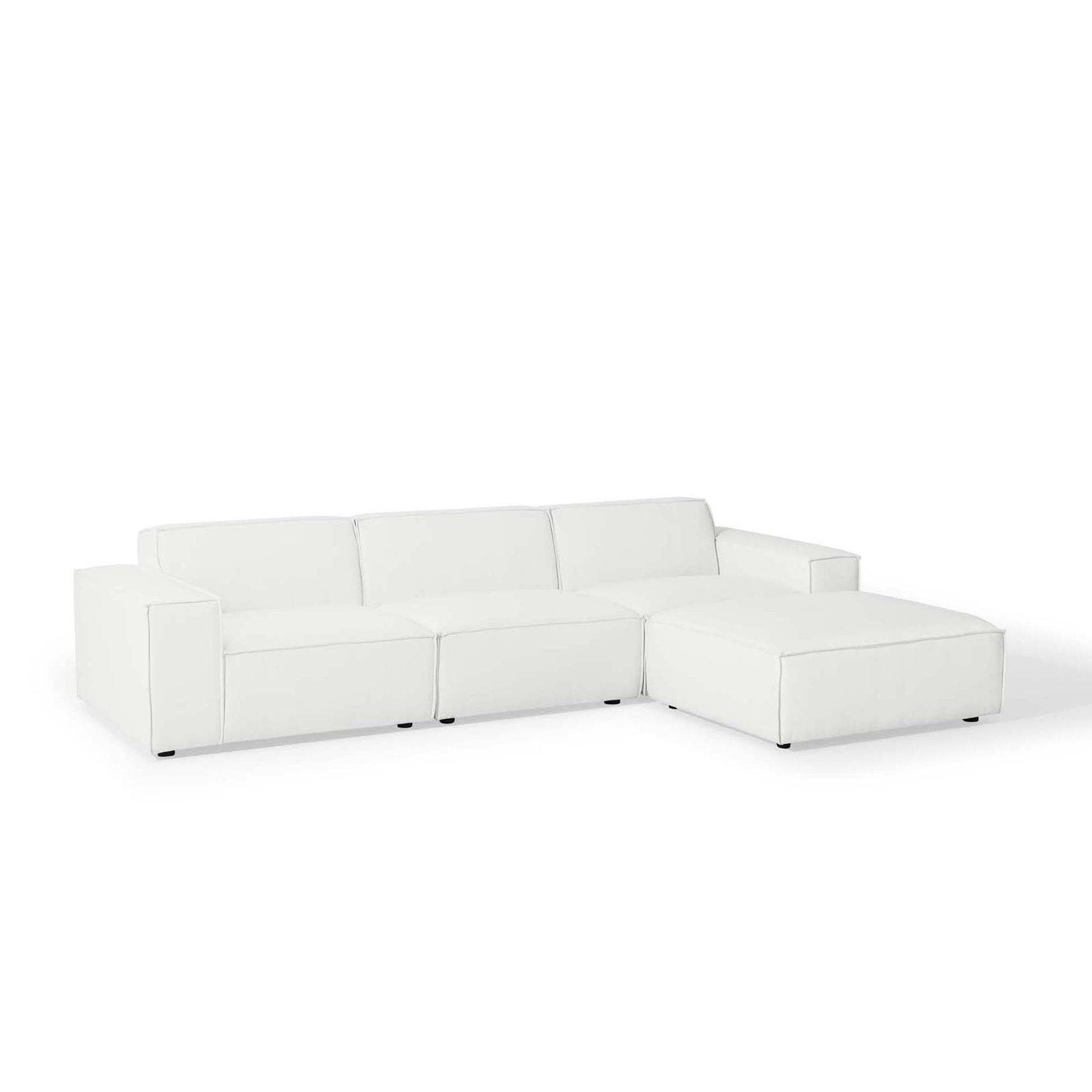 White modular sectional sofa with chaise, clean square arms, low-profile legs, modern living room seating.