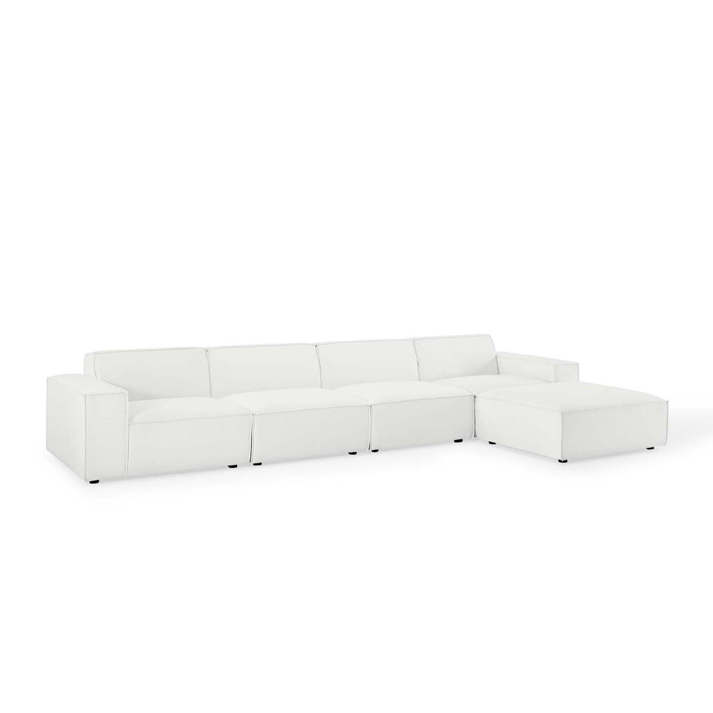 White sectional sofa with chaise on the right, low-profile arms, leatherette upholstery, contemporary style.
