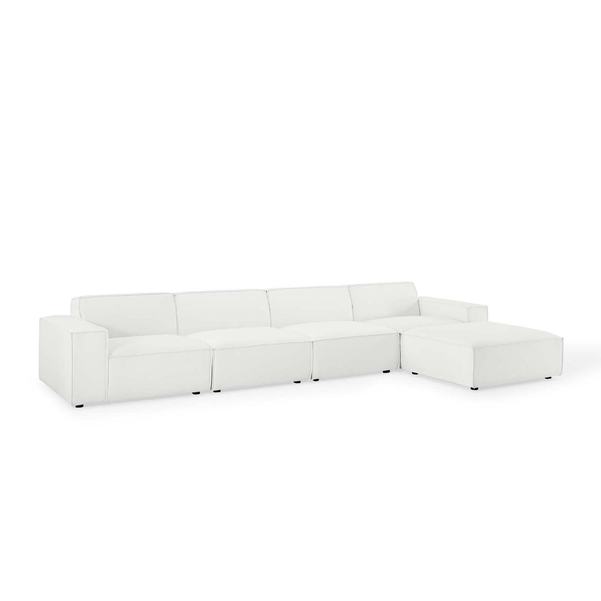 White sectional sofa with chaise on the right, low-profile arms, leatherette upholstery, contemporary style.