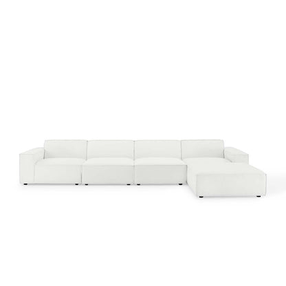 White leather L-shaped sectional sofa with chaise for modern living room.