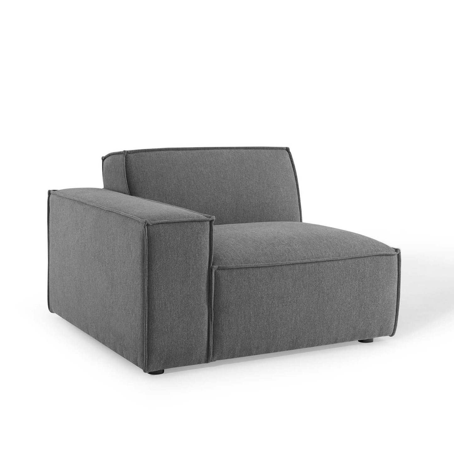 Brown fabric sectional sofa with boxy arms and a low back in a modern living room.