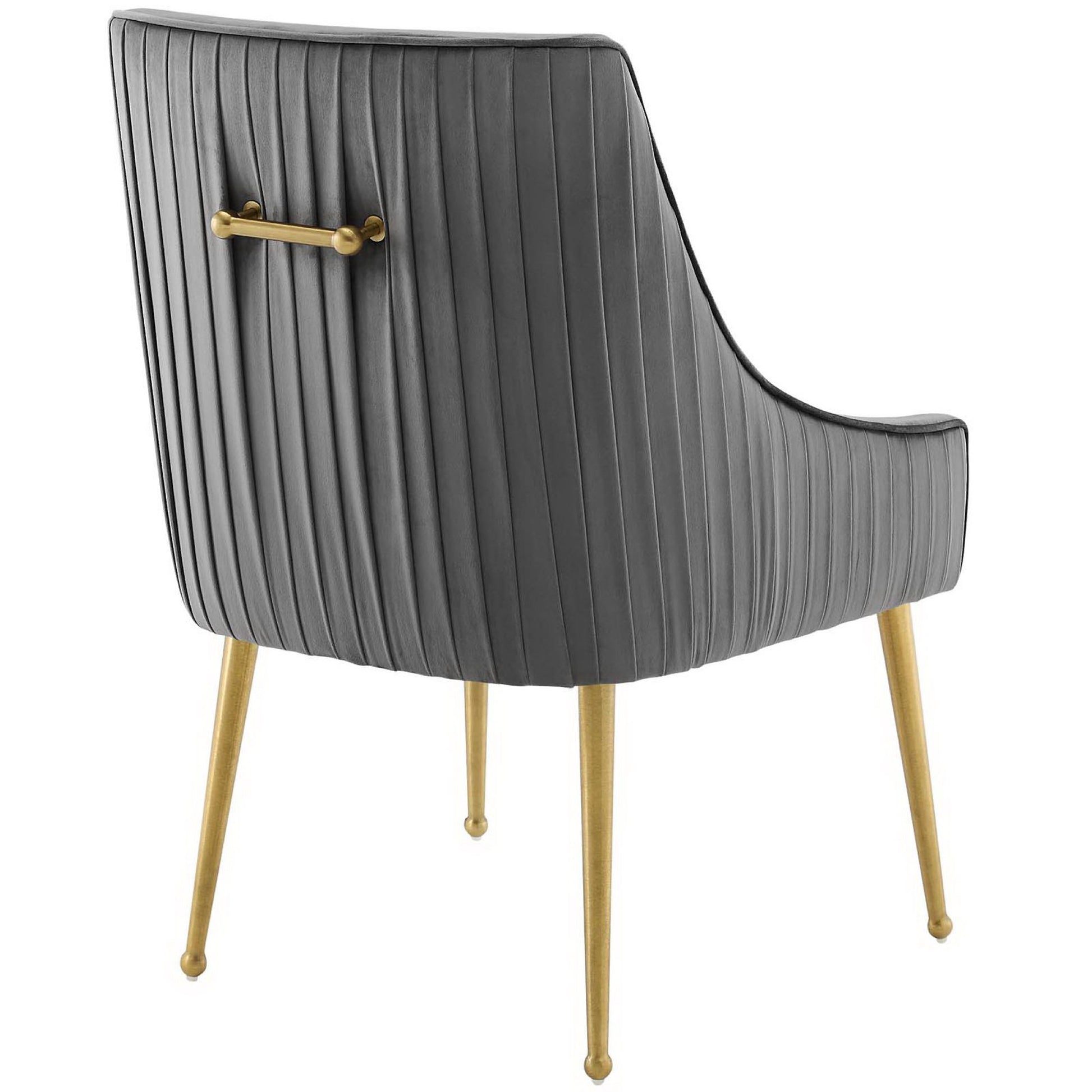 Gray ribbed velvet dining chair with curved back, gold tapered legs and brass back handle.