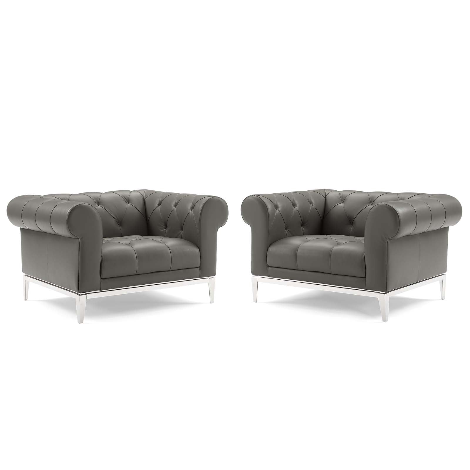 Pair of gray tufted leather armchairs with chrome metal legs, Chesterfield-style lounge seating.