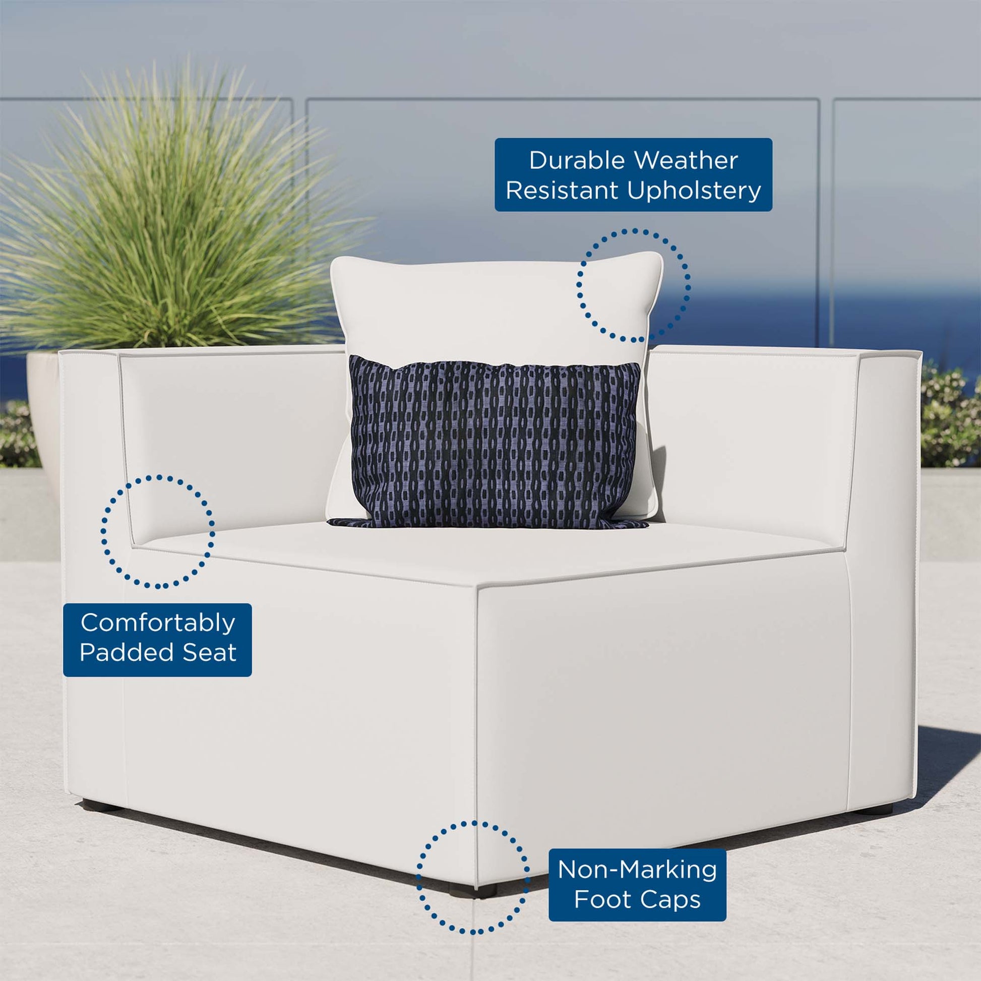 White modular outdoor sectional chair with cushioned seat and navy patterned lumbar pillow, weather-resistant upholstery for patio use.