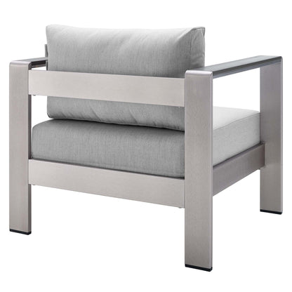 Silver-gray outdoor armchair with a brushed aluminum frame, square arms and a cushioned seat/back.