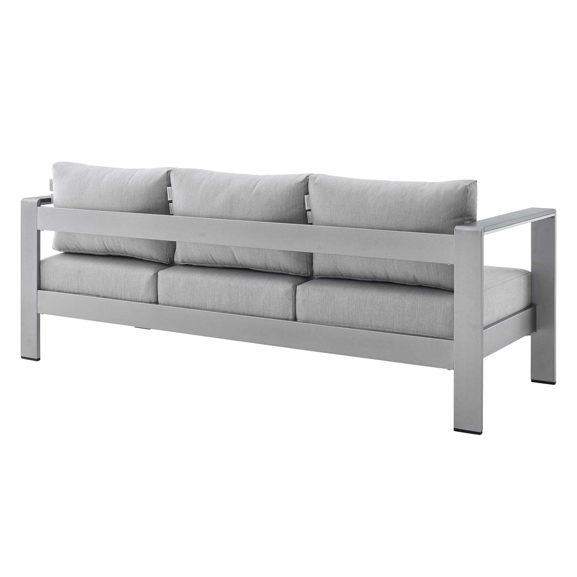 Slate gray modern sofa with a boxy metal frame and three-seat cushions with matching back pillows.