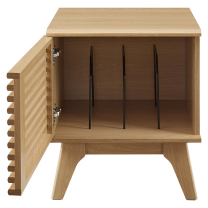 Light oak mid-century vinyl record display stand with angled legs, a slatted front, and three vertical dividers inside forming four compartments.