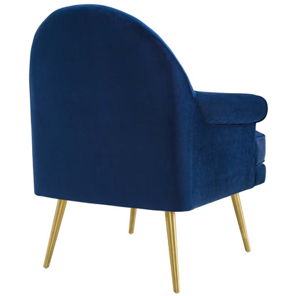 Navy blue velvet armchairs with curved backs, pill-shaped arms, and gold tapered legs; set of 2.