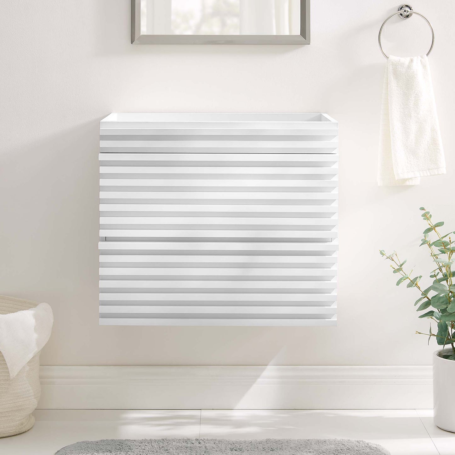 White square wall-mount bathroom vanity cabinet with slatted doors and horizontal grooves in a bright bathroom.