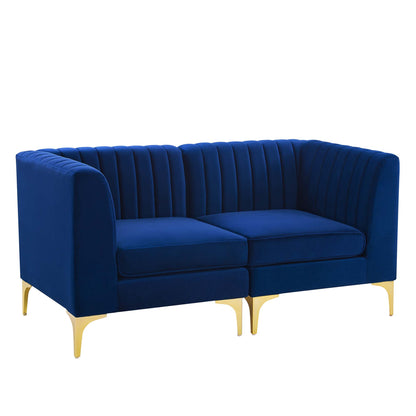 Navy blue velvet loveseat with channel-tufted back, two cushions and curved gold metal legs.