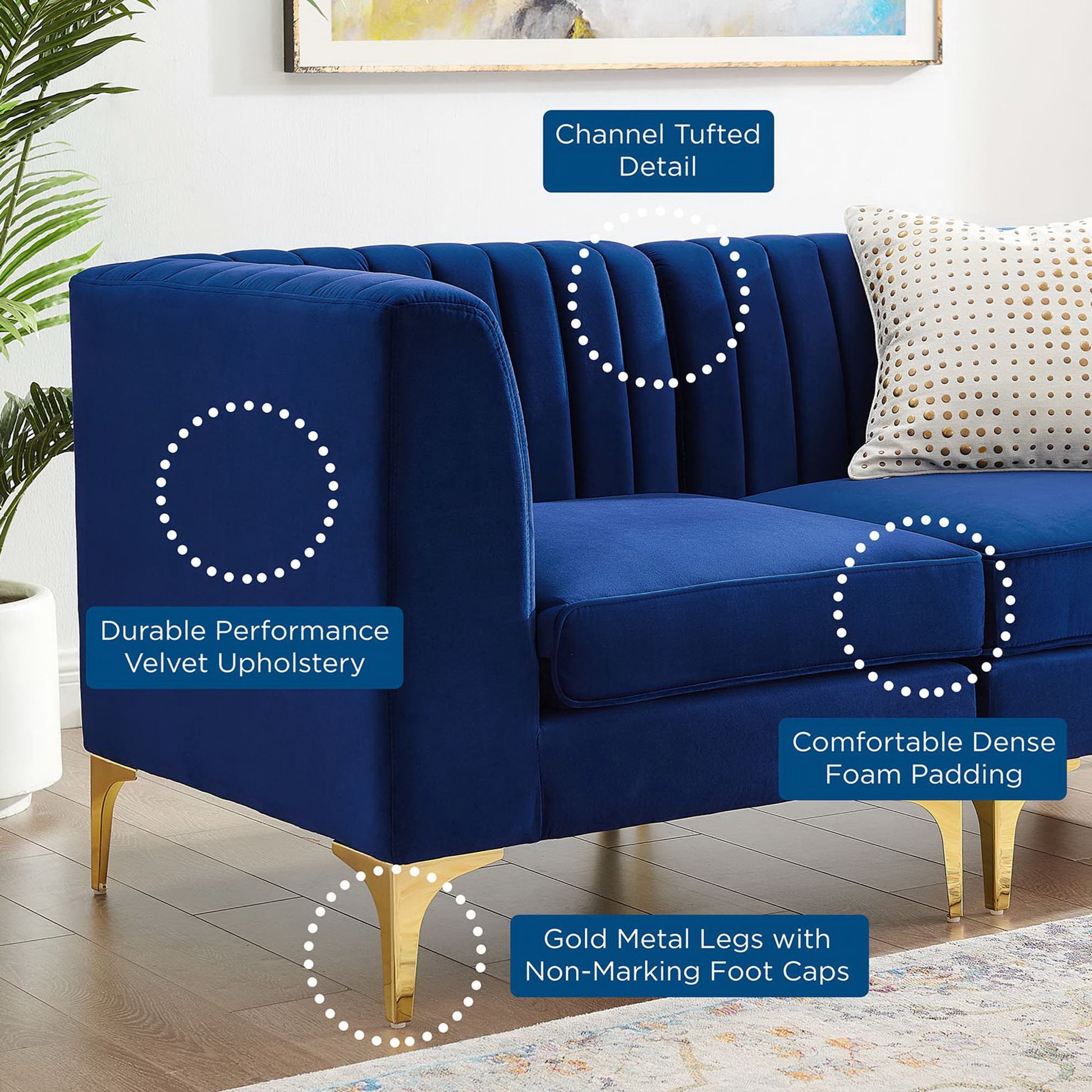 Navy velvet loveseat with channel tufting, dense foam padding, gold metal legs, non-marking caps, and a dotted accent pillow.