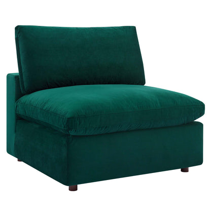 Green velvet armless chair with down-filled overstuffed cushions, boxy base, and short wooden legs.