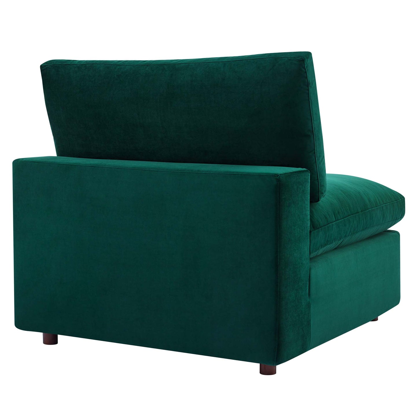 Emerald green velvet armless chair with thick cushion and short dark wood legs.