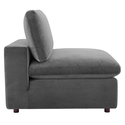 Gray velvet armless chair with a boxy silhouette, a down-filled overstuffed cushion, a single back pillow, and short wooden feet.