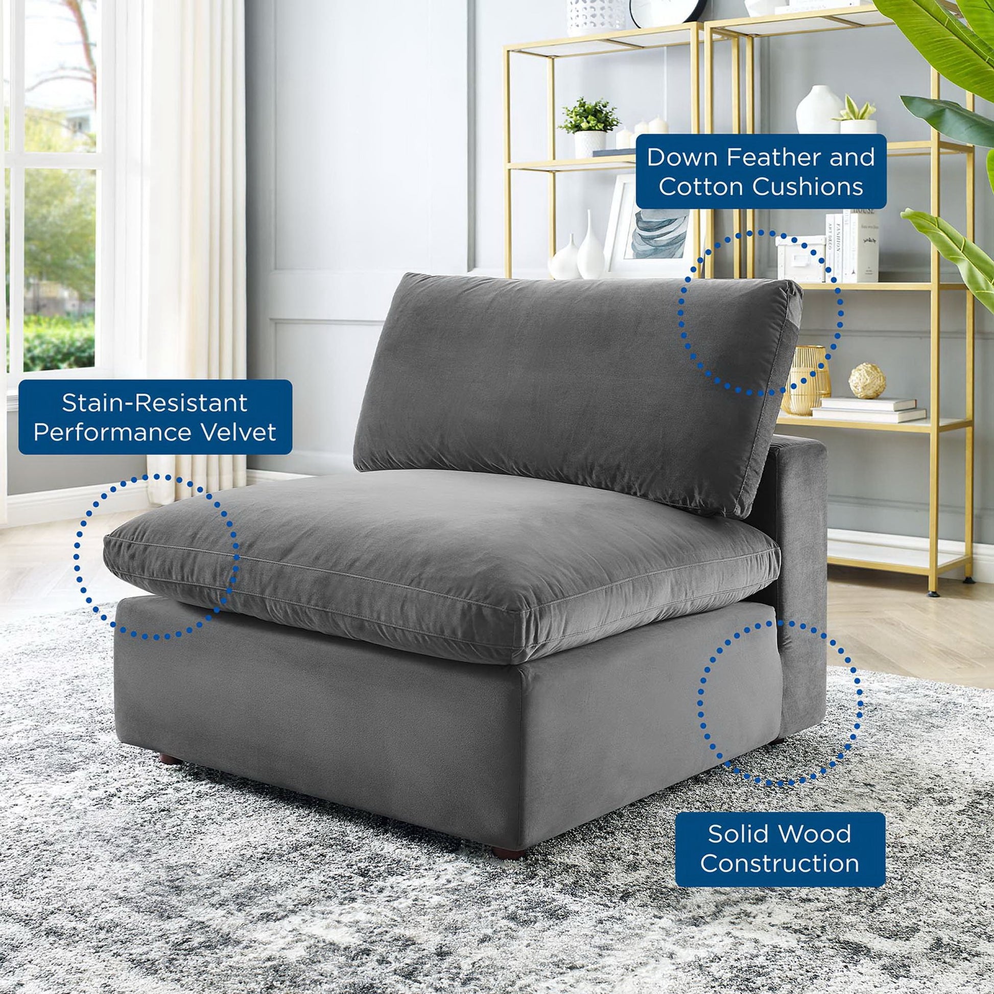 Gray stain-resistant velvet armless chair with down-filled, overstuffed cushions and a solid wood frame in a modern living room.