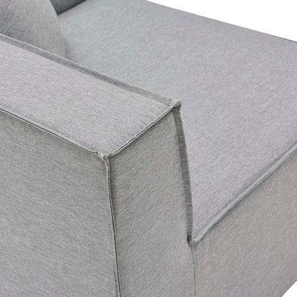 Gray textured fabric sofa armrest close-up with squared edge and cushioned seat.