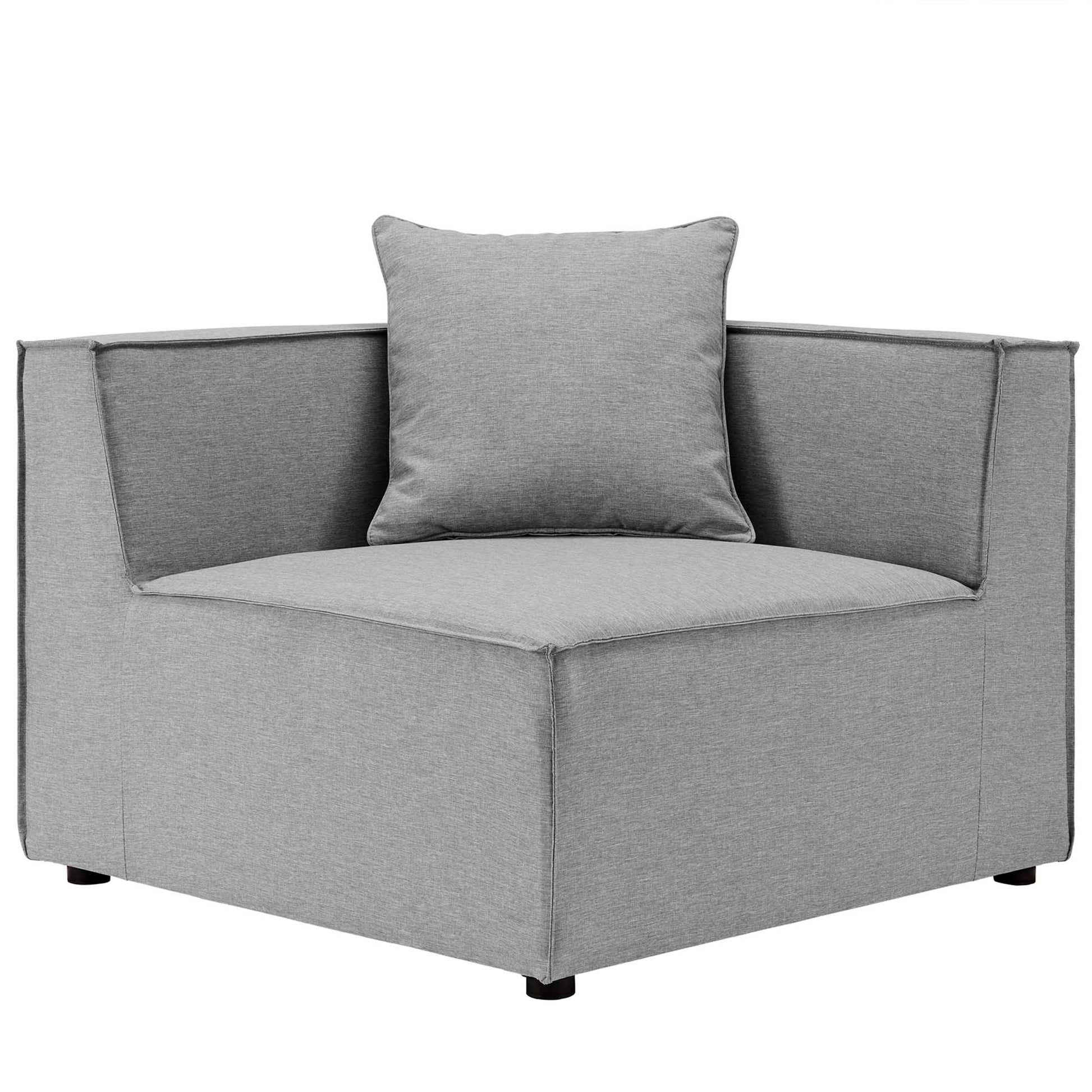 Grey fabric outdoor sectional sofa with square arms, low profile, modular seating and loose back cushions.