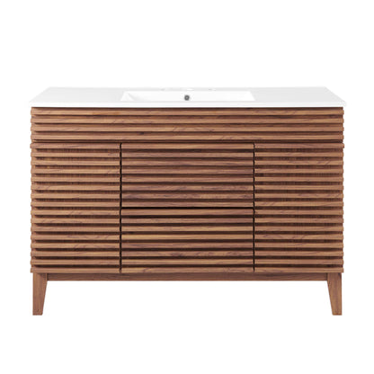 White bathroom vanity with white countertop and integrated sink; horizontal slat cabinet doors on tapered legs.