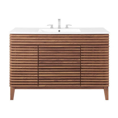 White bathroom vanity with white countertop and sink, horizontally slatted doors, modern storage cabinet, chrome faucet.