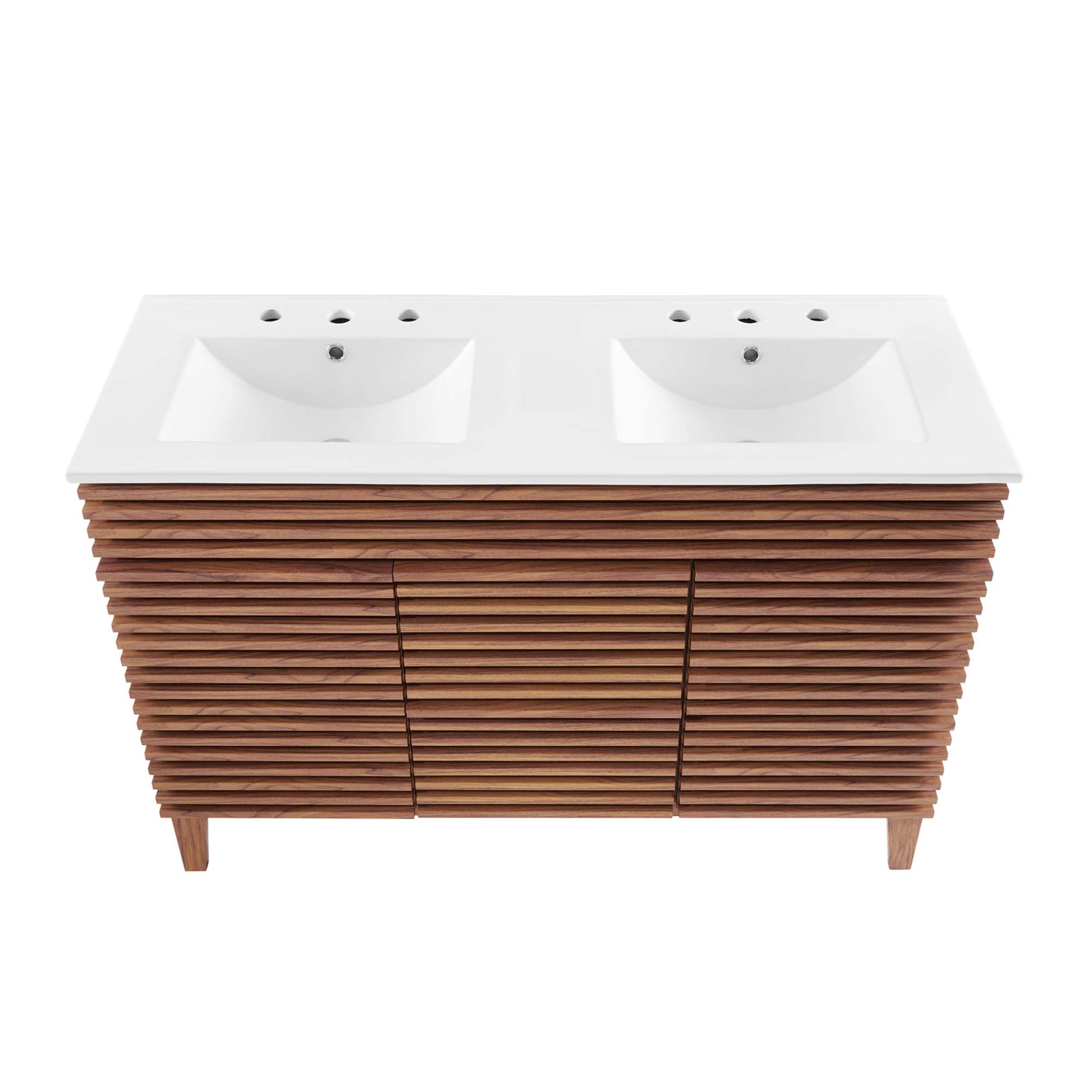 Double sink vanity with white countertop and two rectangular basins atop a walnut slatted cabinet on legs.