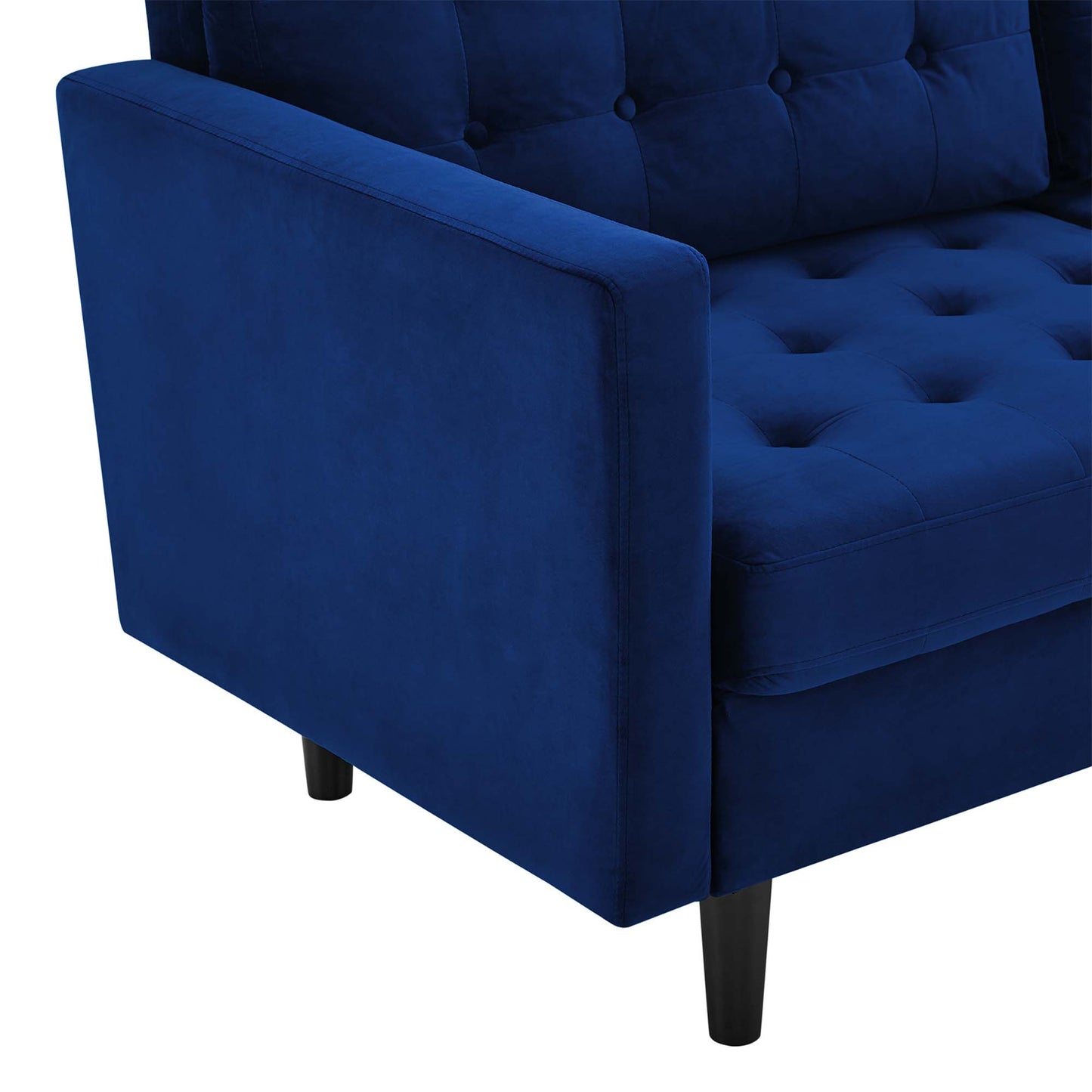 Navy velvet tufted sofa with square arms and tapered legs