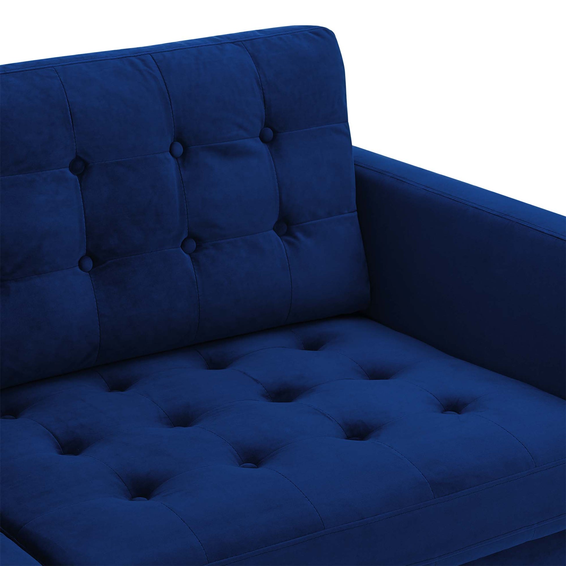 Navy blue velvet tufted sofa with square button tufting, cushioned back and seat, straight arm.