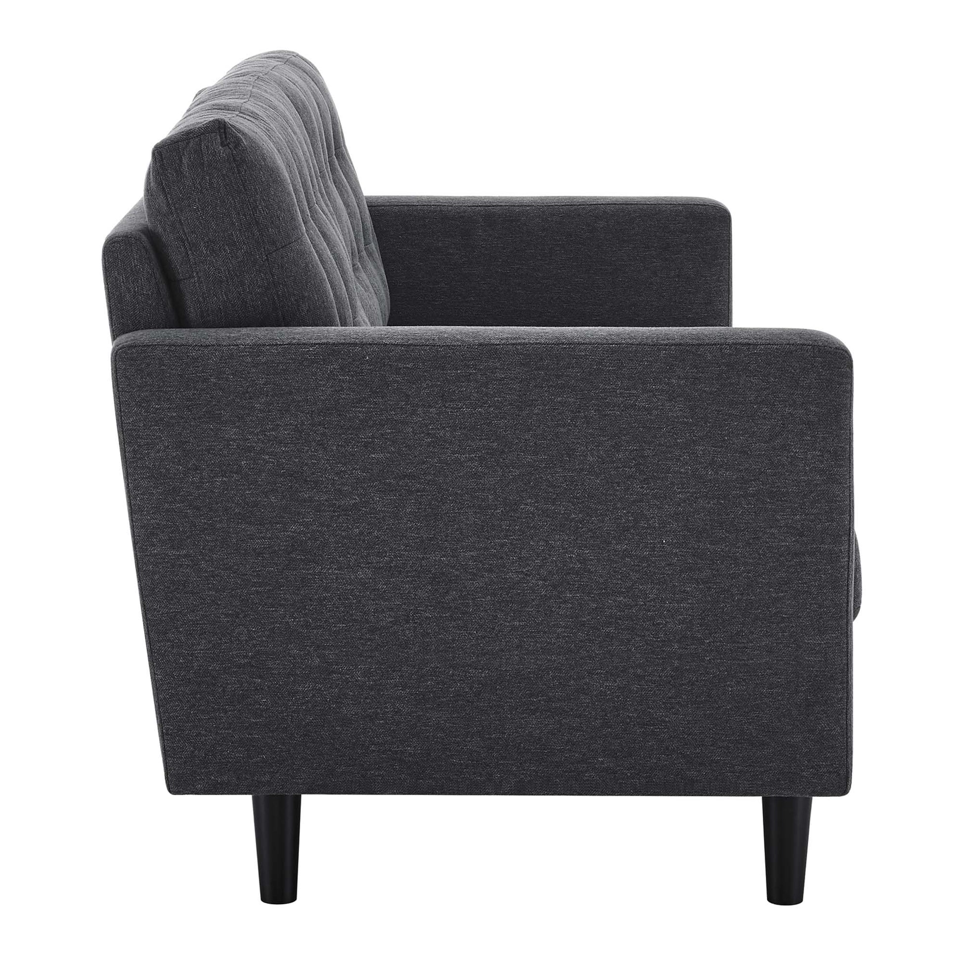 Dark gray fabric sofa with tufted back cushions, straight arms, and tapered black legs; modern mid-century living room seating.