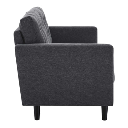 Dark gray fabric sofa with tufted back cushions, straight arms, and tapered black legs; modern mid-century living room seating.
